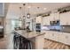 Modern kitchen featuring an island with seating, stainless steel appliances, and hardwood flooring at 2322 Tessa Trce, Clover, SC 29710