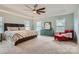 A spacious main bedroom features a tray ceiling, neutral wall paint, and a ceiling fan at 2322 Tessa Trce, Clover, SC 29710