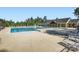 Community pool surrounded by lounge chairs and lush greenery with a clubhouse in the background at 2322 Tessa Trce, Clover, SC 29710