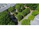 Beautiful aerial view of a community park featuring mature trees, landscaping, and walking paths at 239 N Faulkner Way, Davidson, NC 28036