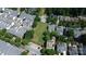 Wide aerial view of a neighborhood featuring green space and well-maintained homes, creating a peaceful community at 239 N Faulkner Way, Davidson, NC 28036