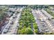 An aerial view shows a residential community with rows of townhomes and mature trees at 239 N Faulkner Way, Davidson, NC 28036