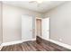 Bedroom featuring hardwood floors, neutral paint, a ceiling fan, and a closet at 239 N Faulkner Way, Davidson, NC 28036