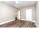 Bedroom featuring hardwood floors, neutral paint, a ceiling fan, and two closets at 239 N Faulkner Way, Davidson, NC 28036