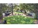 A beautiful community lawn provides seating and green space amongst the mature trees of the community at 239 N Faulkner Way, Davidson, NC 28036