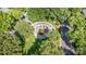 An aerial view shows the community park with a white pergola, seating, landscaping and sidewalks at 239 N Faulkner Way, Davidson, NC 28036