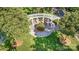 An aerial shot shows a community park with a white pergola and seating amongst shade trees and lawn at 239 N Faulkner Way, Davidson, NC 28036