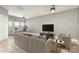 Bright, neutral living room featuring a ceiling fan, large window, and comfortable seating for relaxation at 239 N Faulkner Way, Davidson, NC 28036