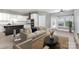 Open-concept living room with modern finishes that integrates the living and kitchen areas at 239 N Faulkner Way, Davidson, NC 28036