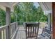 Inviting back deck showcasing the natural beauty of the surrounding forest and providing a peaceful retreat at 2676 Will Schronce Rd, Iron Station, NC 28080
