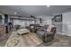 A cozy and spacious living area in the basement, with comfortable seating and stylish decor at 2676 Will Schronce Rd, Iron Station, NC 28080