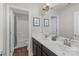 Bathroom featuring double sink vanity, modern fixtures, and a shower/tub combo for convenience at 2902 Oakdale Rd, Charlotte, NC 28216