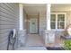 Inviting front porch with stone pillars, showcasing a warm and welcoming entrance to the home at 2902 Oakdale Rd, Charlotte, NC 28216