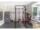 Fully equipped home gym with weight rack, providing a convenient and private workout space at 2902 Oakdale Rd, Charlotte, NC 28216