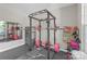 Home gym equipped with weight rack, weights, and exercise equipment for convenient workouts at 2902 Oakdale Rd, Charlotte, NC 28216