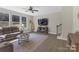 Bright living room with a ceiling fan, and comfortable seating, perfect for relaxation at 2902 Oakdale Rd, Charlotte, NC 28216