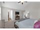 This main bedroom features a large bed and a television on the wall at 2902 Oakdale Rd, Charlotte, NC 28216