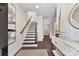 Open foyer featuring staircase, decorative sailboat, and a decorative light fixture and hardwood flooring at 330 Armour St # 46, Davidson, NC 28036