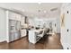 Open kitchen features stainless steel appliances, a large island with seating, and bright white cabinets at 330 Armour St # 46, Davidson, NC 28036