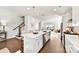Bright, open kitchen boasts a large island with pendant lighting and stainless steel appliances at 330 Armour St # 46, Davidson, NC 28036