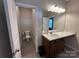 Bathroom featuring a single sink vanity and a separate toilet area at 348 Ox Bow Cir, Mount Holly, NC 28120