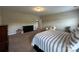 Spacious bedroom with plush carpeting and large bed with striped bedding at 348 Ox Bow Cir, Mount Holly, NC 28120