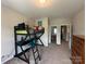 Bedroom featuring a bunk bed with desk and ladder and neutral carpet floors at 348 Ox Bow Cir, Mount Holly, NC 28120
