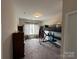 A modern bedroom featuring a lofted bed, carpet floors and natural light at 348 Ox Bow Cir, Mount Holly, NC 28120