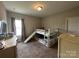 The bedroom features a bunkbed with a slide, neutral carpet, and natural lighting at 348 Ox Bow Cir, Mount Holly, NC 28120