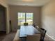 Bright dining area features a large window and a rustic wood table with bench seating at 348 Ox Bow Cir, Mount Holly, NC 28120