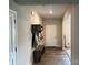 The home's entryway features attractive hardwood floors, a hall tree, and neutral paint at 348 Ox Bow Cir, Mount Holly, NC 28120