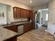 Well-appointed kitchen features wood cabinets, stainless steel appliances and granite countertops at 348 Ox Bow Cir, Mount Holly, NC 28120