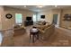 Comfortable living room with plush sofas, a coffee table, and plenty of natural light at 348 Ox Bow Cir, Mount Holly, NC 28120