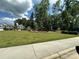 Community playground with green space and a line of trees at 348 Ox Bow Cir, Mount Holly, NC 28120