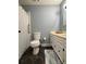 Well-lit bathroom features a shower with curtain, toilet, and white vanity with storage at 3660 9Th Street Ne Dr, Hickory, NC 28601