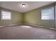Bedroom with two windows and carpet flooring at 3660 9Th Street Ne Dr, Hickory, NC 28601