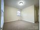 Neutral bedroom has a window for natural light and carpeting at 3660 9Th Street Ne Dr, Hickory, NC 28601