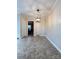 Neutral dining room with stylish light fixture and adjoining room view at 3660 9Th Street Ne Dr, Hickory, NC 28601