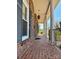 Covered front porch featuring brick flooring and column supports at 3660 9Th Street Ne Dr, Hickory, NC 28601