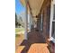 Inviting covered front porch with brick flooring and classic columns at 3660 9Th Street Ne Dr, Hickory, NC 28601