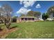 Charming brick home with a well-manicured lawn and mature trees at 3660 9Th Street Ne Dr, Hickory, NC 28601