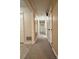 Long hallway with carpet and access to several rooms at 3660 9Th Street Ne Dr, Hickory, NC 28601