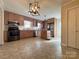 Open kitchen with wood cabinetry, stainless appliances, and center island at 3660 9Th Street Ne Dr, Hickory, NC 28601