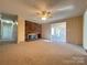 Inviting living room featuring a fireplace and adjacent sunroom with french doors at 3660 9Th Street Ne Dr, Hickory, NC 28601