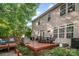Backyard deck with outdoor seating, perfect for relaxing and enjoying the scenery at 3915 Planters Watch Dr, Charlotte, NC 28278