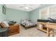 Relaxing bedroom featuring a bed and window views, with accent chair at 3915 Planters Watch Dr, Charlotte, NC 28278