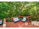 This cozy deck features comfortable seating and scenic wooded views, creating a peaceful retreat at 3915 Planters Watch Dr, Charlotte, NC 28278
