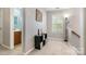 Open hallway featuring carpet flooring, a view of a bathroom, and natural light at 3915 Planters Watch Dr, Charlotte, NC 28278