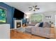 Cozy living room featuring a fireplace, large TV, and comfortable sectional sofa at 3915 Planters Watch Dr, Charlotte, NC 28278