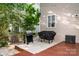 Outdoor patio area featuring grilling space and a convenient storage box at 3915 Planters Watch Dr, Charlotte, NC 28278